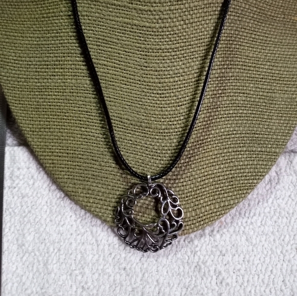 Silvertone swirl round Pendant on black cord necklace - Picture 1 of 5